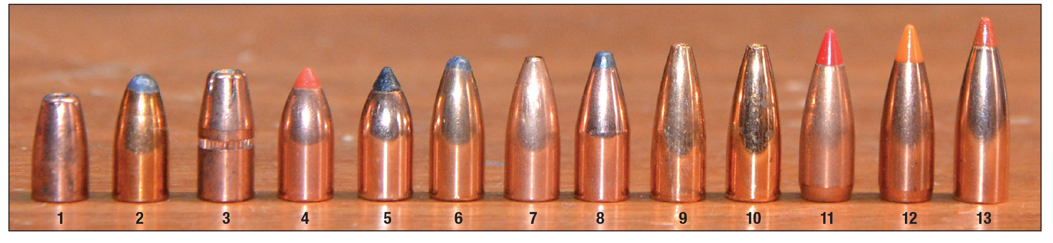 The rifling twist rate of a 22 Hornet barrel dictates the maximum bullet length that will be stabilized in flight with 1:14 twist capable of handling longer bullets than 1:16 twist. Bullets shown here are arranged from shortest to longest: (1) Speer 33-grain HP, (2) Speer 40-grain SP, (3) Hornady 45-grain Bee, (4) Hornady 35-grain V-MAX, (5) Nosler 35-grain FB Tipped, (6) Speer 45-grain SP, (7) Nosler 40-grain FBHP, (8) Hornady 45-grain SP, (9) Berger 30-grain FB Varmint, (10) Berger 40-grain FB Varmint, (11) Hornady 40-grain V-MAX, (12) Nosler 40-grain Ballistic Tip and (13) Nosler 35-grain Lead Free BT.